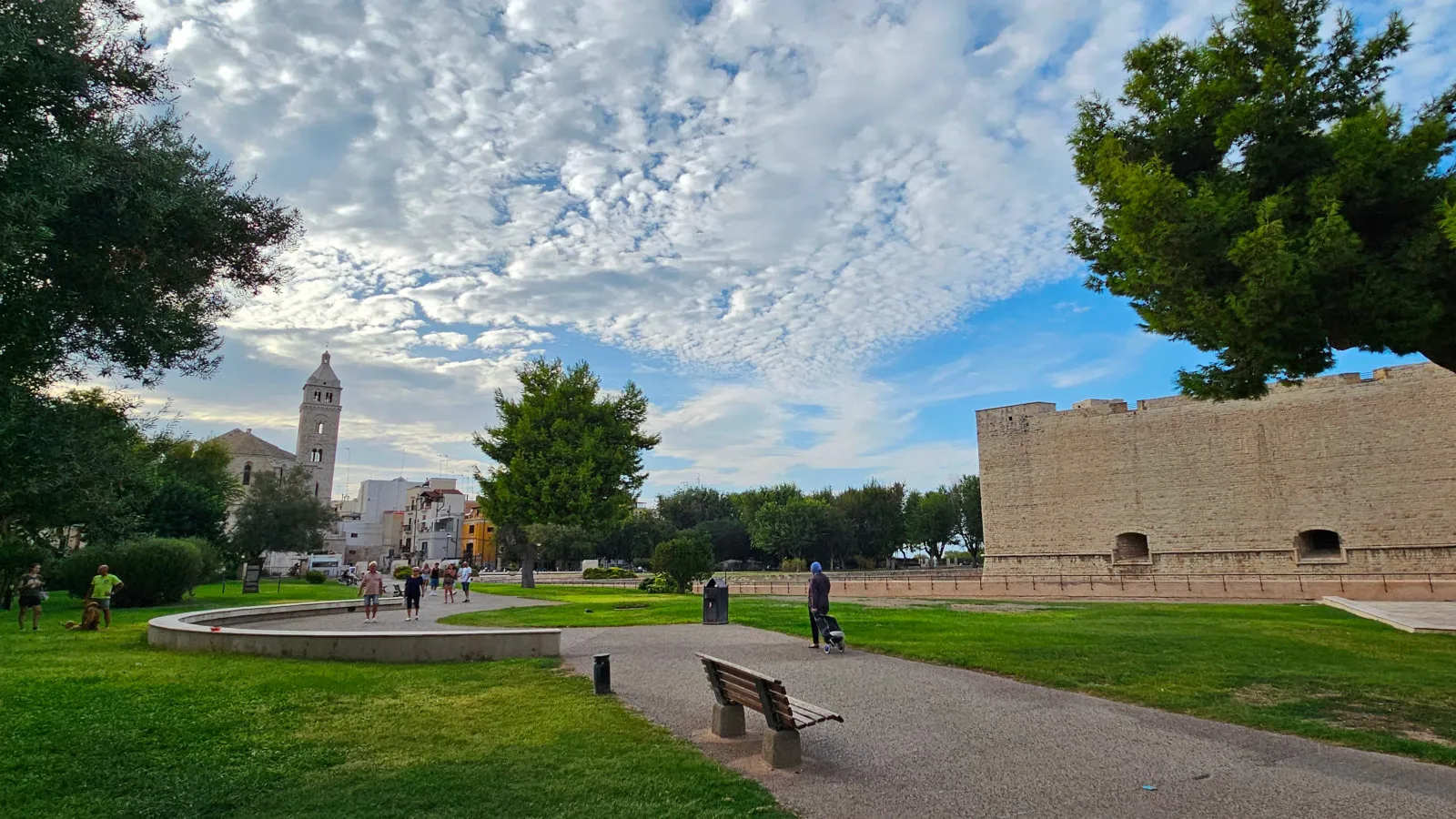 Barletta, the park in front of the Norman-Swabian Castle with a view of the Basilica of San Sepolcro