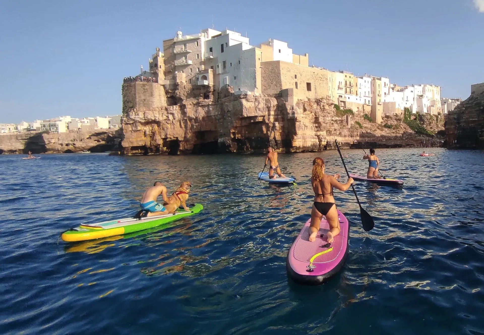 Stand Up Paddle excursion with instructor among the sea caves of Polignano a Mare