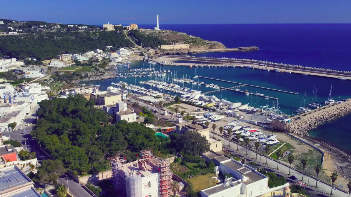 Santa Maria di Leuca view of the seafront, the small port and the lighthouse at the top of Punta Meliso in the background